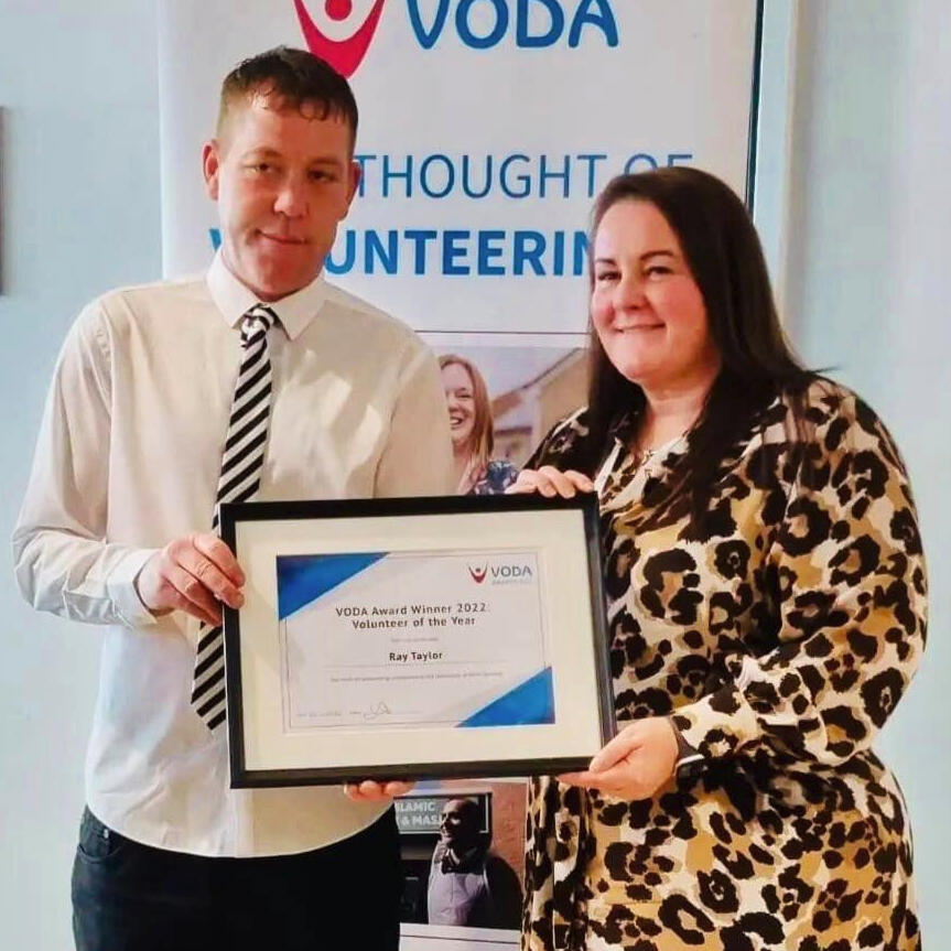 Ray, our head coach, receiving an award for being 'Volunteer of the Year' from VODA.